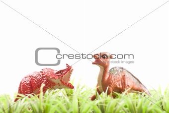 Two Herbivore Toy Dinosaurs in Grass