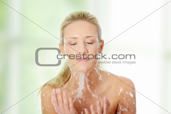 Female washing her face