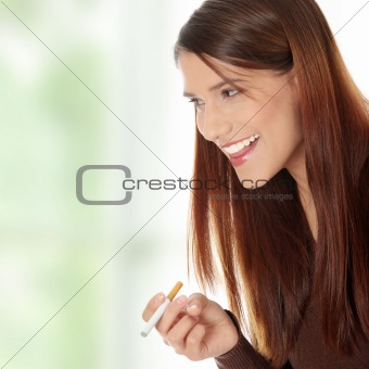 Young woman smoking electronic cigarette