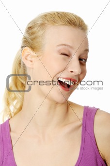 Woman with big smile blinking.