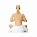 Young beautiful nude blond woman meditating