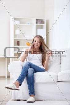 Cheerful girl talking on the phone