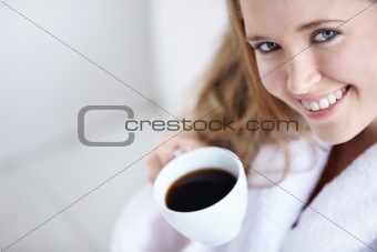 Beautiful girl with a coffee close up