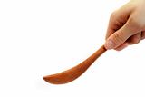 wooden spoon for cooking in the hand