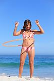 Woman playing with a hula hoop