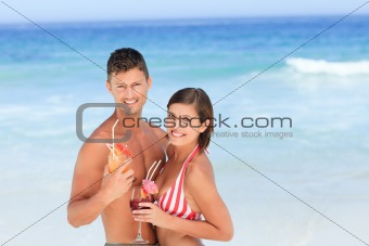 Adorable couple drinking a cocktail