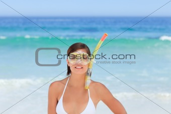 Woman with her mask at the beach