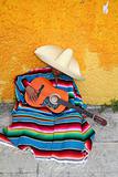 Mexican typical lazy man sombrero hat guitar serape