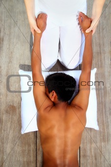massage therapy stretch shiatsu on wooden floor