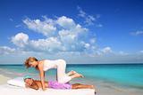 Caribbean beach therapy shiatsu massage on knees