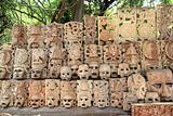 Mayan wood mask rows Mexico handcraft faces