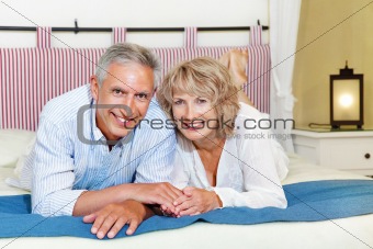 Happy mature couple at home