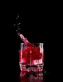 red martini cocktail splashing