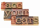 face your fears phrase in letterpress type