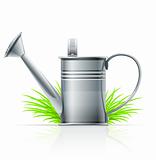 watering can and grass