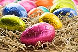 Colorful easter eggs in straw