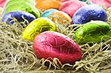 Colorful easter eggs in straw