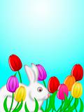 White Easter Bunny Amongst Colorful Tulips