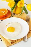 Scrambled eggs and oranges for breakfast