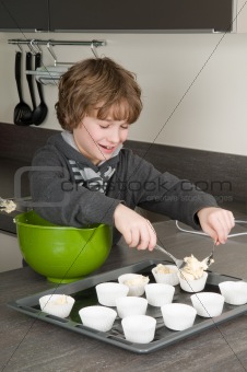 Kid Filling Cake cups With Dough