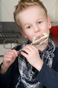 Boy Eating Dough From A Beater