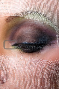The woman\'s face with beautiful green eyes