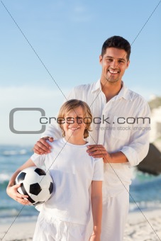 Father and  his son on the beach
