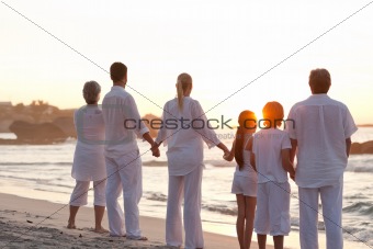 Family at the beach during the sunset