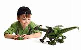 Young boy playing with dinosaur