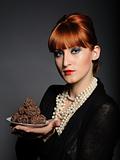 Beautiful elegant fashion woman with chocolate truffle sweets