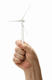 Male Fist Holding Wind Turbine Isolated on a White Background.