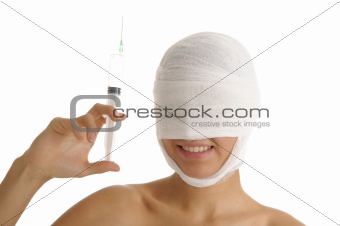 woman with her ??head in bandages holding syringe