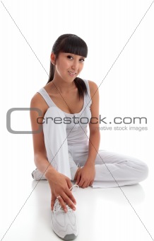 Beautiful smiling woman sitting on the floor