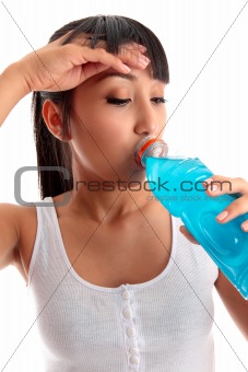 Exhausted girl drinking after fitness workout