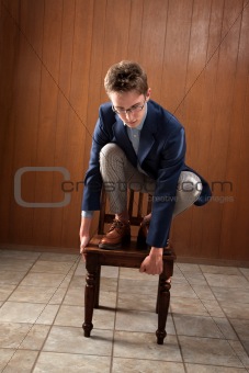 Man Stands On Chair
