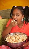 Little Girl Eats Popcorn