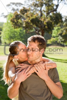 Woman hugging her handsome husband