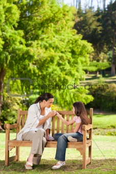 Cute girl with her mother in the park