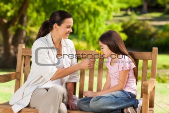 Cute girl with her mother in the park