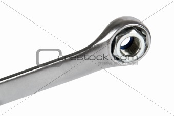 The image of a wrench with a nut, isolated, on a white backgroun