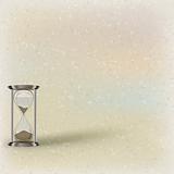 hourglass on beige background