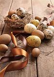 Brown and yellow eggs with ribbons for easter