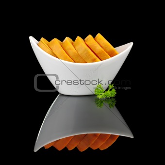 Cooked Sweet Potato with Parsley on Black