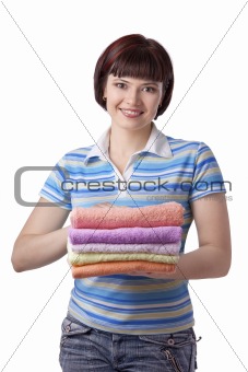 Woman holding clean towels
