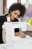 Fashion designer with sewing machine