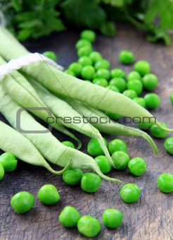 Green peas on the wooden board