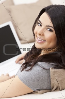 Happy Hispanic Woman Using Laptop Computer