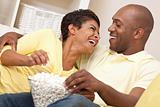 Happy African American Couple Eating Popcorn Watching Movie 