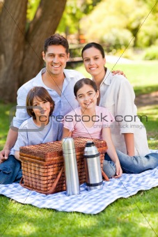 Happy family picnicking in the park