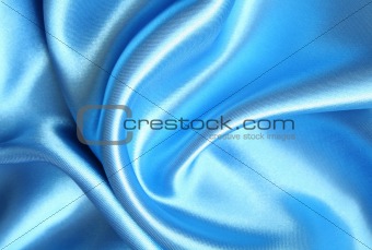 Smooth elegant blue silk as background